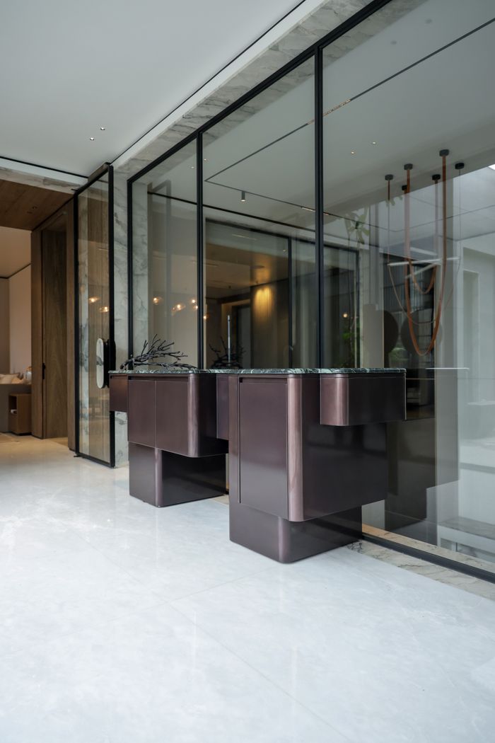 Home Contemporary luxury interior featuring sleek glass partitions and stylish minimalist design.