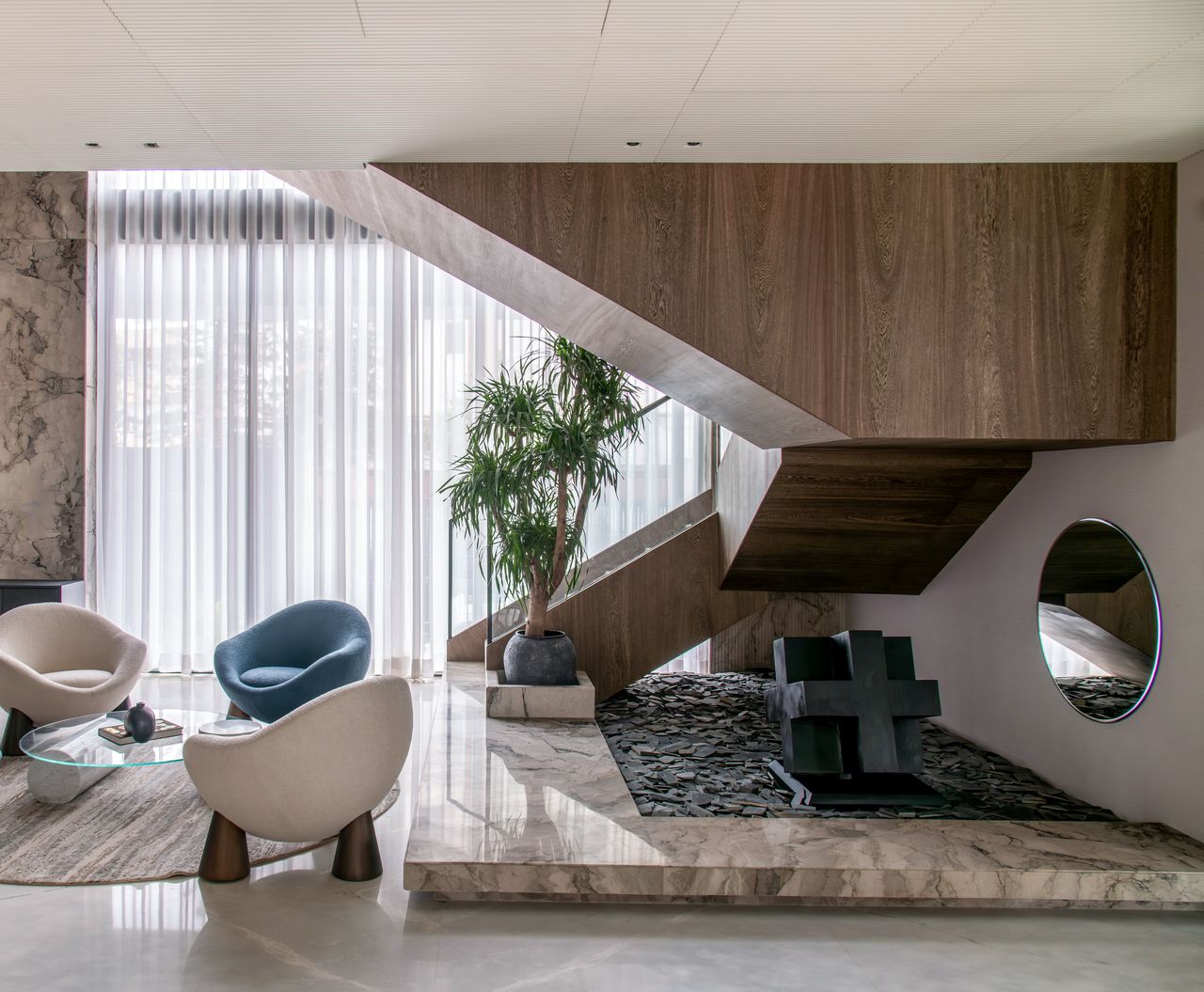Home Chic interior showcasing a modern staircase, elegant seating, and decorative elements.