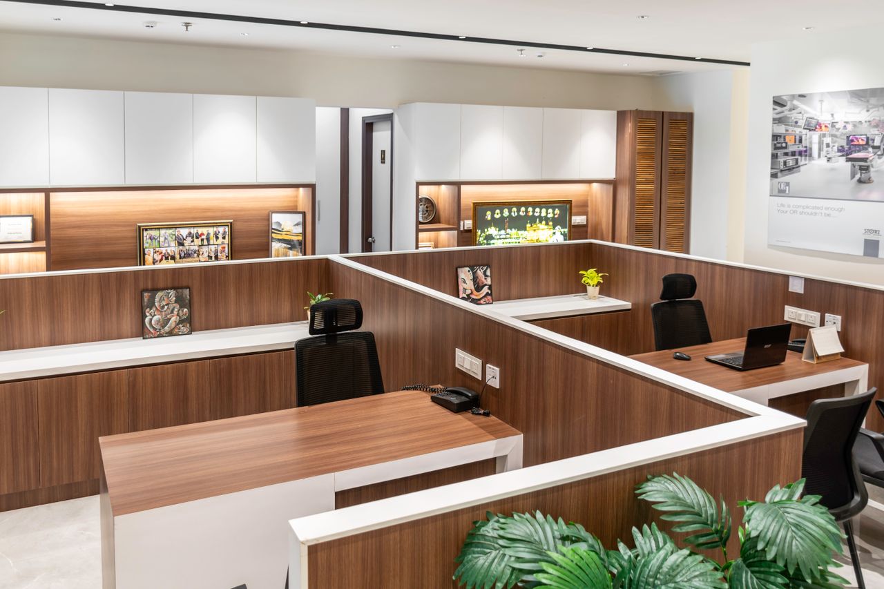 Services Contemporary office cubicles in a sleek, modern design with wood accents.