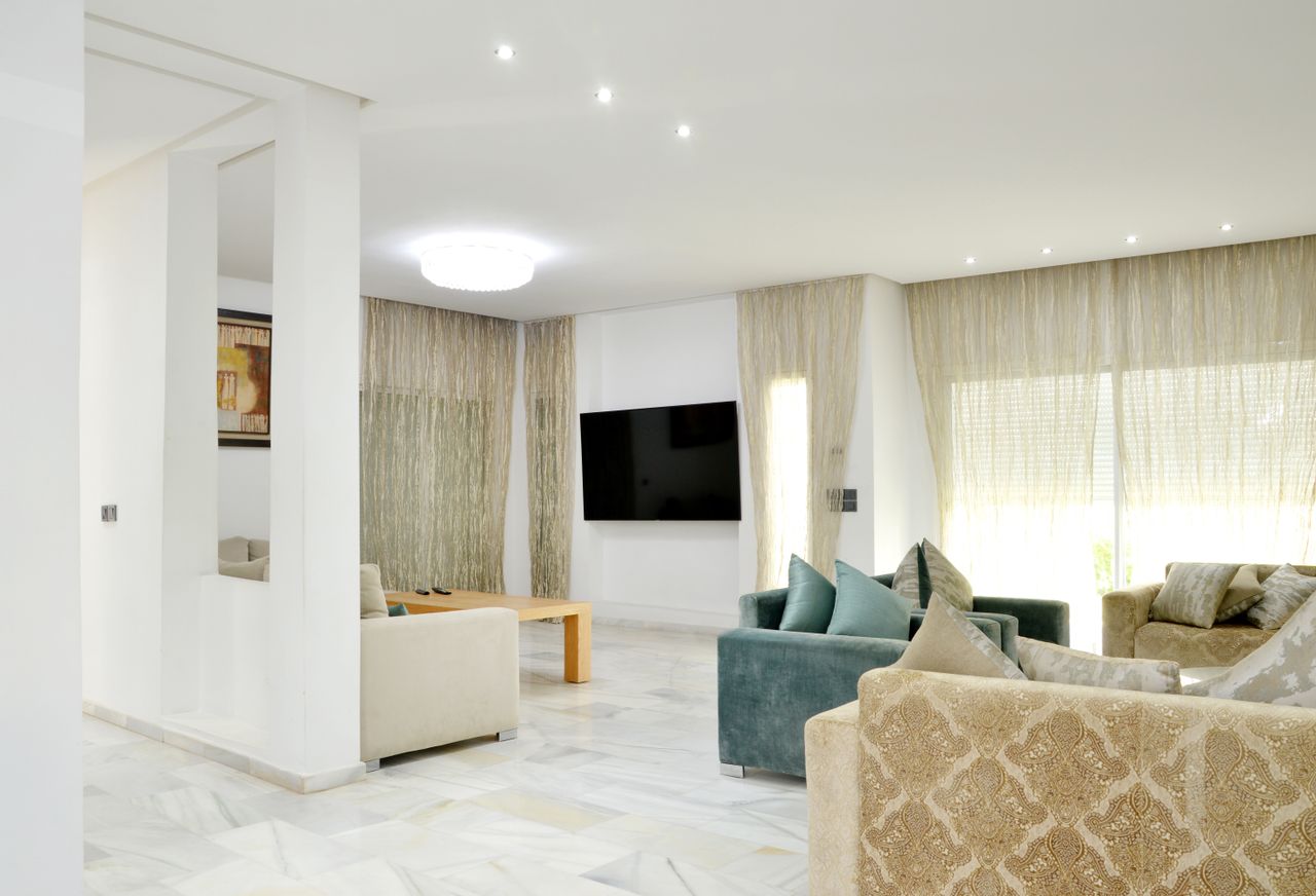 Home Spacious modern living room with elegant sofas and stylish decor.