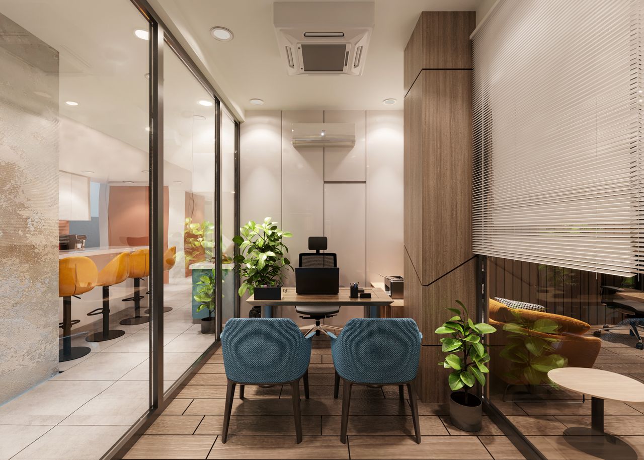 Services A stylish, modern office interior featuring a meeting area with blue chairs and wooden accents.
